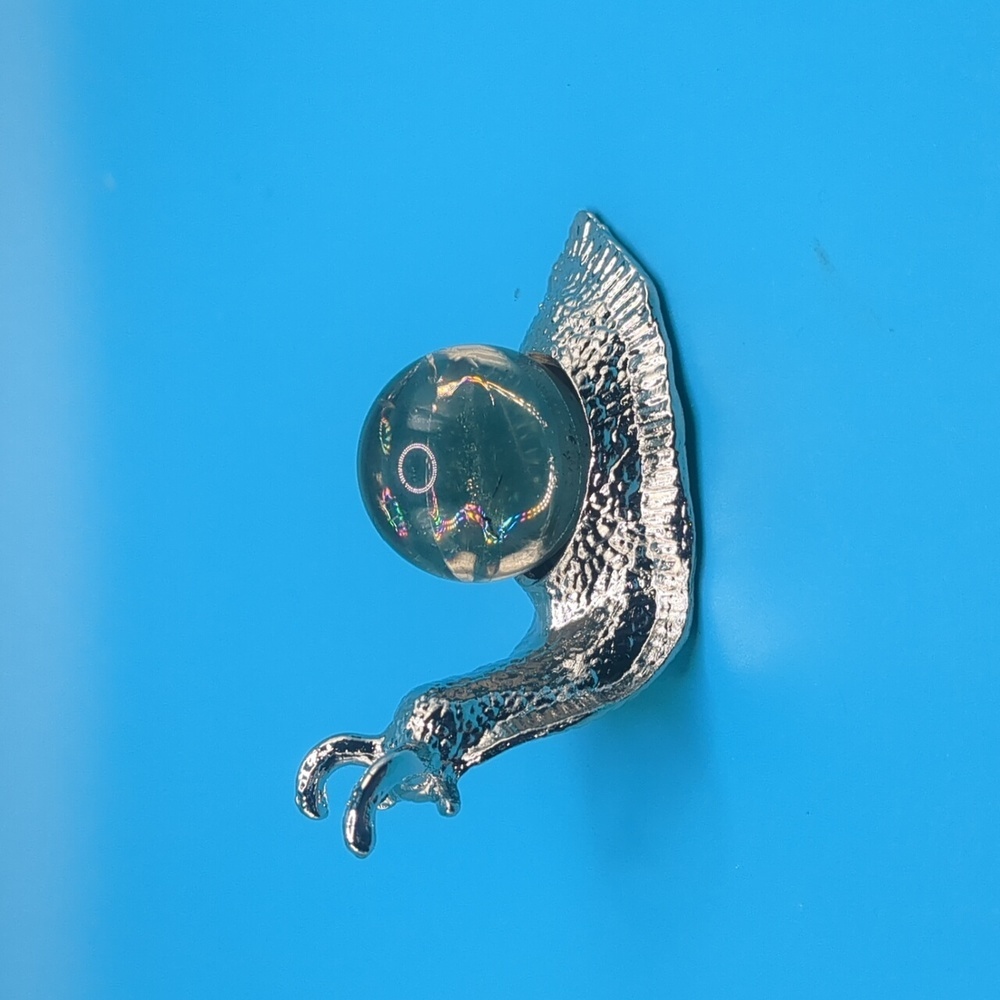 Adorable snail sphere holder with rainbow smoky quartz mini sphere